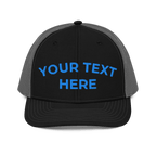 Black and charcoal Richardson 112 trucker hat with custom embroidered text